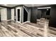 Finished basement featuring laminate flooring, sliding barn door, and built in shelves at 626 Discovery Ct, Acworth, GA 30102