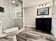 Modern bathroom featuring a marble tile shower, sleek vanity, and contemporary fixtures at 626 Discovery Ct, Acworth, GA 30102