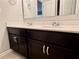 Bathroom with double sinks, updated cabinets, and tile floors at 626 Discovery Ct, Acworth, GA 30102