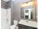 Bathroom with tub/shower combination, vanity with sink, and modern lighting at 626 Discovery Ct, Acworth, GA 30102