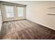 Bedroom with carpet, two windows and neutral colored walls at 626 Discovery Ct, Acworth, GA 30102
