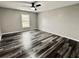 Bright bedroom with wood-look flooring and large window, perfect for rest and relaxation at 626 Discovery Ct, Acworth, GA 30102