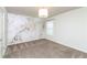 Bedroom with a stylish accent wall, carpet and modern lighting at 626 Discovery Ct, Acworth, GA 30102