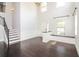 Bright, two-story foyer with hardwood floors, staircase, and large window at 626 Discovery Ct, Acworth, GA 30102