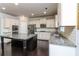 Stylish kitchen featuring white cabinets, granite countertops, stainless appliances, and subway tile at 626 Discovery Ct, Acworth, GA 30102