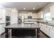 Elegant kitchen with white cabinets, granite counters, a center island, and hardwood floors at 626 Discovery Ct, Acworth, GA 30102