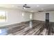 Open concept living area with modern ceiling fans, natural light, and beautiful flooring at 626 Discovery Ct, Acworth, GA 30102