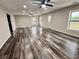 Spacious living room featuring wood-look flooring, neutral walls, recessed lighting and a double ceiling fan at 626 Discovery Ct, Acworth, GA 30102
