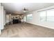 Spacious living room featuring a view of the open kitchen and access to the backyard at 626 Discovery Ct, Acworth, GA 30102