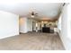 Open-concept living room flows seamlessly into a kitchen with modern appliances and dark wood floors at 626 Discovery Ct, Acworth, GA 30102