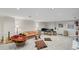 Inviting finished basement boasting neutral carpet, recessed lights, and versatile space for entertaining or relaxing at 7750 Landowne Dr, Atlanta, GA 30350
