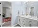 Bright bathroom with a large double sink vanity and a shower visible through the open door at 7750 Landowne Dr, Atlanta, GA 30350