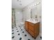 Cozy bathroom with shower and tub combination featuring decorative tile flooring at 7750 Landowne Dr, Atlanta, GA 30350