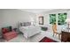 Cozy bedroom with ample natural light, a sitting chair, and plush carpeting for ultimate relaxation at 7750 Landowne Dr, Atlanta, GA 30350
