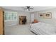 Bright bedroom with desk, neutral walls, and window with shutters providing natural light and ventilation at 7750 Landowne Dr, Atlanta, GA 30350
