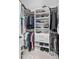 Organized closet with hanging racks, shelving for shoes and clothing, and built-in drawers for optimal storage at 7750 Landowne Dr, Atlanta, GA 30350