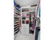 Well-organized walk-in closet with custom shelving, drawers, and ample hanging space for clothes and accessories at 7750 Landowne Dr, Atlanta, GA 30350
