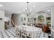 Open dining area flows into a sunroom, offering bright and airy living space at 7750 Landowne Dr, Atlanta, GA 30350