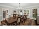 Formal dining room with a large table, chandelier, and beautiful trim work at 7750 Landowne Dr, Atlanta, GA 30350