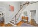 Elegant foyer with hardwood floors, a staircase, and access to multiple rooms at 7750 Landowne Dr, Atlanta, GA 30350