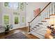 Grand foyer with a staircase, hardwood floors, and plenty of natural light at 7750 Landowne Dr, Atlanta, GA 30350