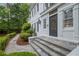Exterior showcasing a beautifully landscaped walkway leading to the front door at 7750 Landowne Dr, Atlanta, GA 30350