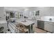 Spacious kitchen with white cabinets, stainless steel appliances, and an island at 7750 Landowne Dr, Atlanta, GA 30350