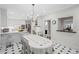 Bright and airy kitchen and dining area with large windows and chandelier at 7750 Landowne Dr, Atlanta, GA 30350