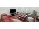 Comfortable living room featuring neutral tones, hardwood floors, and a decorative area rug at 7750 Landowne Dr, Atlanta, GA 30350