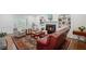 Cozy living room with fireplace, built-in bookshelves, and comfortable seating at 7750 Landowne Dr, Atlanta, GA 30350