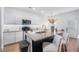 Well-equipped kitchen with granite countertops, a black kitchen island, and stylish bar stools at 1388 Ben Park Way, Grayson, GA 30017