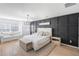 Spacious main bedroom boasts a decorative accent wall and hardwood flooring at 1388 Ben Park Way, Grayson, GA 30017