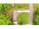 Aerial view of a home with a long driveway and a lush green yard at 4781 Lincoln Ne Dr, Kennesaw, GA 30144