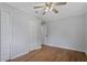 Bedroom with wood-look floors, ceiling fan and closet at 4781 Lincoln Ne Dr, Kennesaw, GA 30144