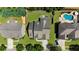 Expansive backyard featuring a pristine pool, lounge area, and lush landscaping at 1156 Whisper Cove Dr, Buford, GA 30518