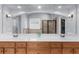 Bright bathroom featuring double vanity with large mirrors at 1156 Whisper Cove Dr, Buford, GA 30518