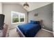 Cozy bedroom with a large window and a bed with rustic wooden frame at 1156 Whisper Cove Dr, Buford, GA 30518