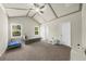 Bedroom with vaulted ceiling and a large open floorplan at 1156 Whisper Cove Dr, Buford, GA 30518