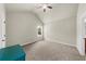 Bright primary bedroom features vaulted ceiling, ceiling fan and carpet flooring at 1156 Whisper Cove Dr, Buford, GA 30518