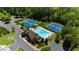 Community amenities include tennis courts and a luxurious swimming pool with a slide, surrounded by lush trees at 1156 Whisper Cove Dr, Buford, GA 30518