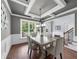 Bright dining room featuring large windows and coffered ceilings at 1156 Whisper Cove Dr, Buford, GA 30518