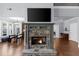 Stone fireplace with a mantel as a focal point in this open-concept living space at 1156 Whisper Cove Dr, Buford, GA 30518