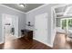 Well-lit hallway leads to laundry room and dining area at 1156 Whisper Cove Dr, Buford, GA 30518