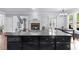 Kitchen with island with granite countertops, stainless steel appliances, wood floors, and an open concept at 1156 Whisper Cove Dr, Buford, GA 30518