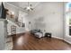 Spacious living room with hardwood flooring, fireplace, and staircase leading to the second floor at 1156 Whisper Cove Dr, Buford, GA 30518