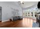 Bright and airy living room with vaulted ceiling, hardwood floors, and fireplace feature at 1156 Whisper Cove Dr, Buford, GA 30518