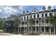 Modern townhome exteriors featuring covered front porches and light brick at 1975 Flying Scotsman Dr # 18, Kennesaw, GA 30144