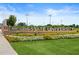 Exterior shot showcasing the Kennesaw State University sign surrounded by green grass and colorful flowers at 1975 Flying Scotsman Dr # 18, Kennesaw, GA 30144