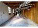 Unfinished basement area with exposed ductwork, and framed walls, offering ample space and customization options at 3844 Davis St, Suwanee, GA 30024