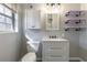 Updated bathroom with granite vanity, gray walls, and a window at 3844 Davis St, Suwanee, GA 30024
